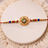 Traditional Kundan Rakhi With Antique Gold Finish Multicolor Beads