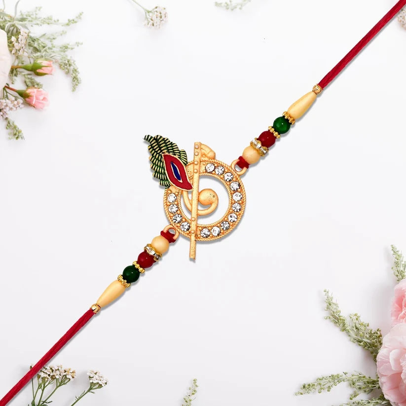 Krishna Flute Rakhi With Stone Studded Peacock Feather Design