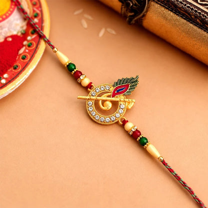 Krishna Flute Rakhi With Stone Studded Peacock Feather Design