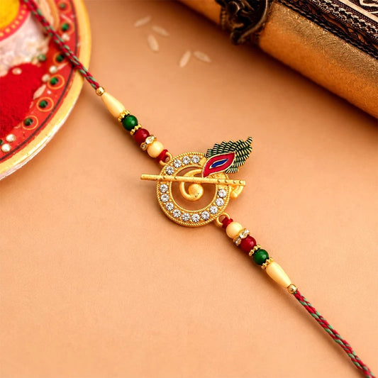 Krishna Flute Rakhi With Stone Studded Peacock Feather Design